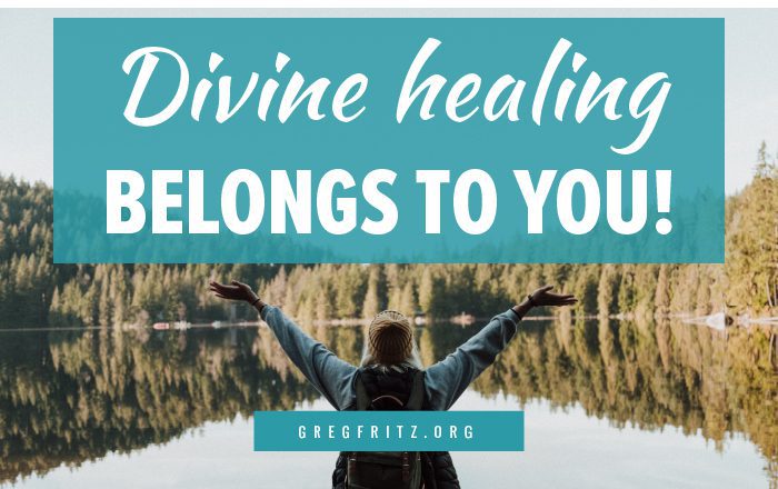 Person standing with arms on a lakeshore, with the words: divine healing belongs to you!